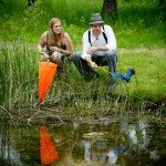 frog hunting engagement session northern michigan image