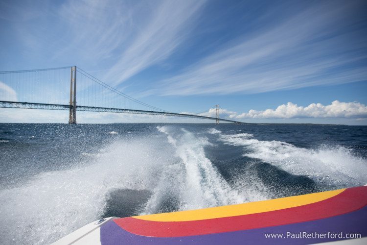 leaving mackinac bridge in wake photo