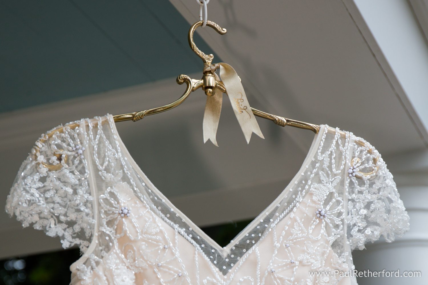 wedding dress hanging photo