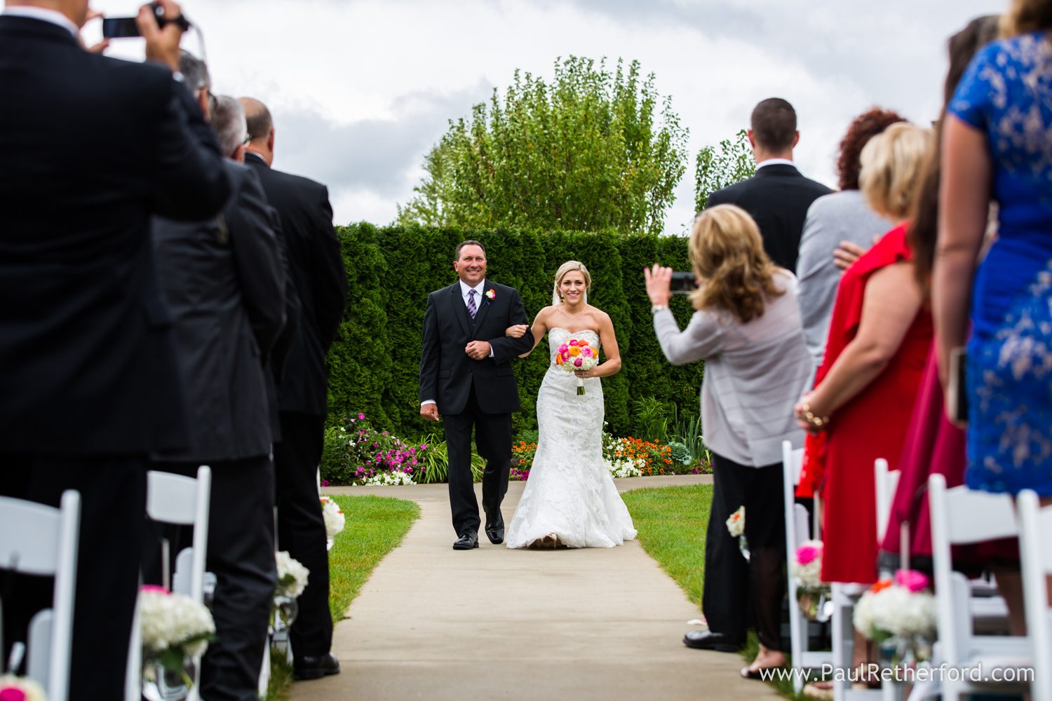 bride wedding aisle father