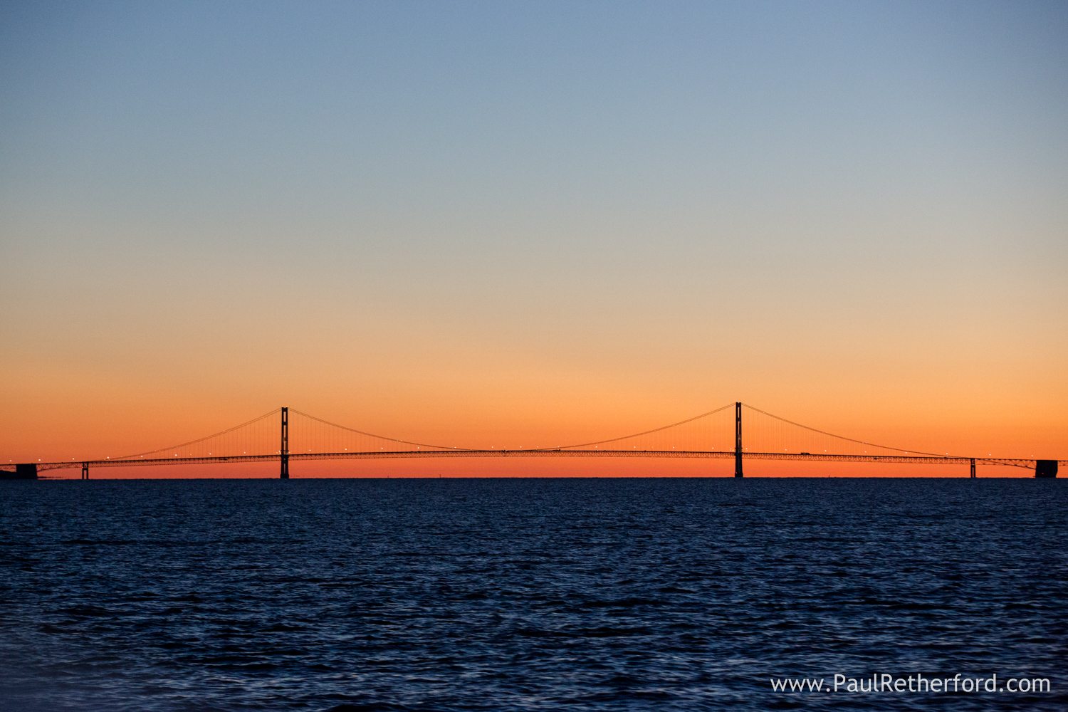 sunset over mackinac bridge photo