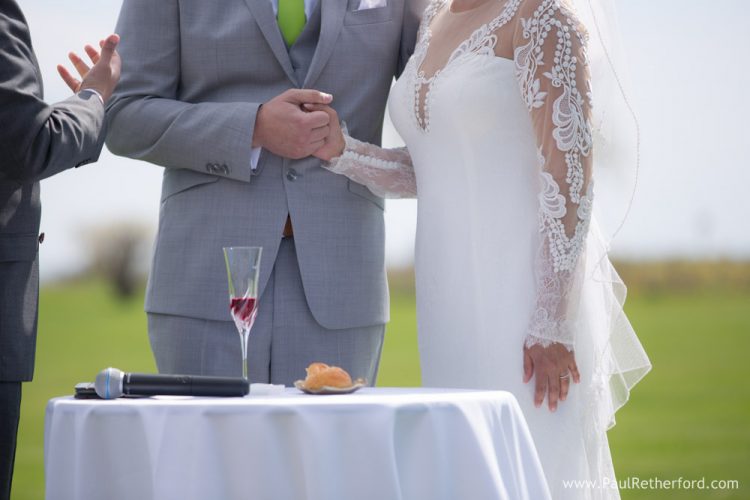 holding hands mackinac island wedding