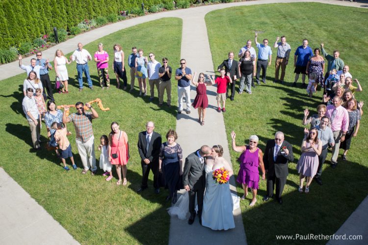 heart with wedding guests and family photo