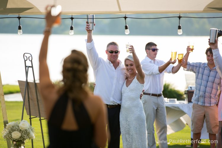 Boyne Mountain Beach House Wedding Photography Deer Lake toasts boyne beach house wedding photo
