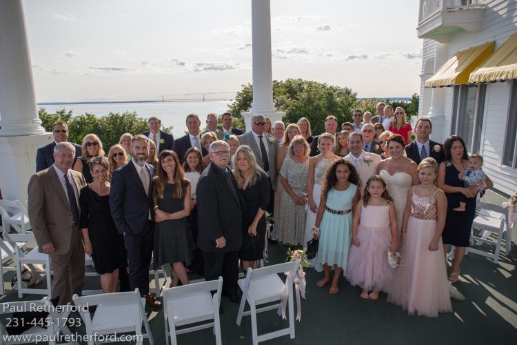 group photo wedding west porch grand hotel