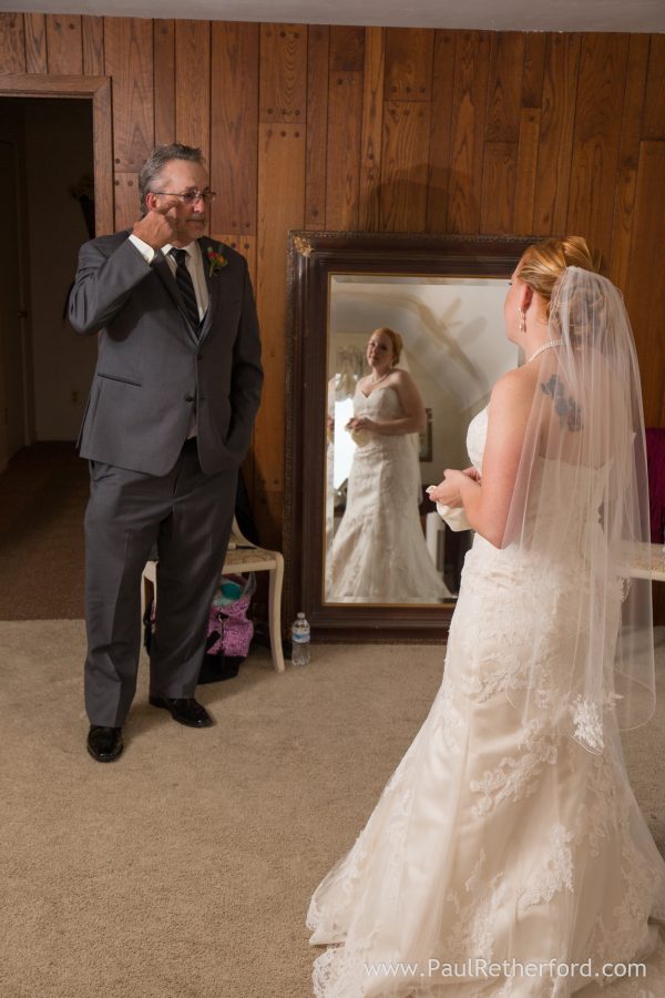 father seeing daughter wedding for first time photo