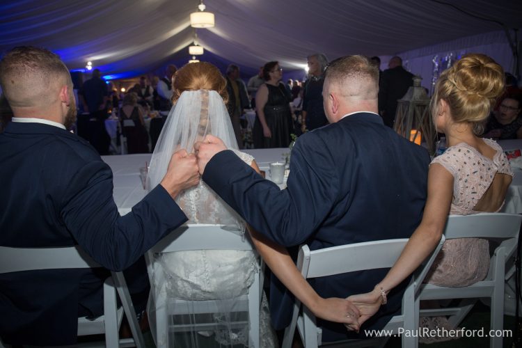 holding hands fist bump wedding photo