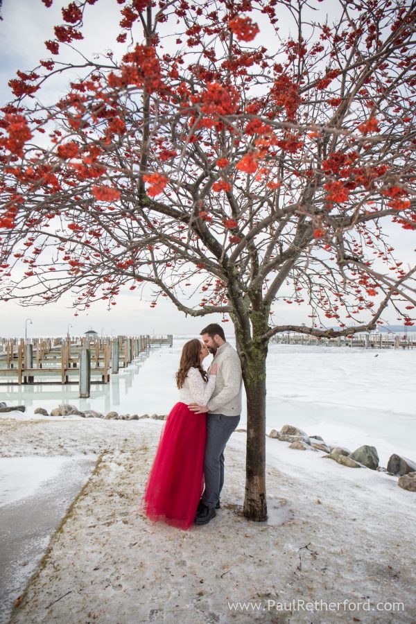 red winter engagement photo